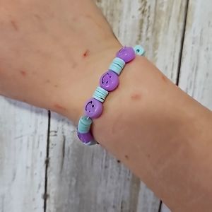 Clay bead bracelet with pastel purple and teal colors